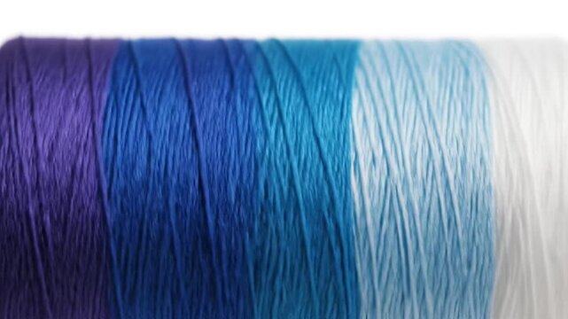 Close up of multicolored thread on a white background studio shot with copy space