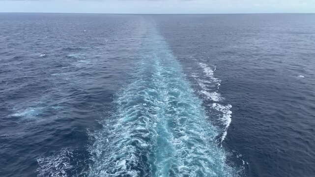 Waves from back of large ship on the ocean