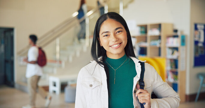 Learning, portrait and smile of girl student on high school campus for development or growth. Education, future and study with happy teen learner in academy hallway for knowledge or opportunity