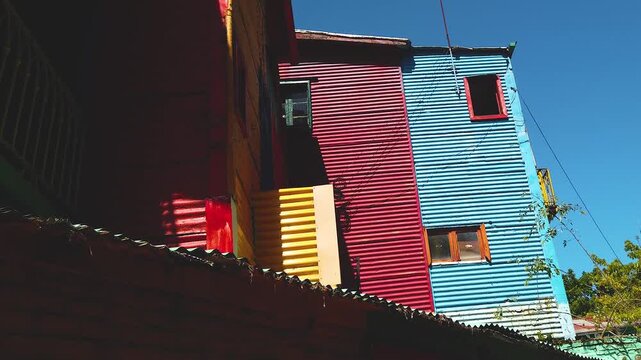 Low angle of Caminito Buenos Aires Argentine city ghetto colorful houses, plate architecture, La boca neighborhood