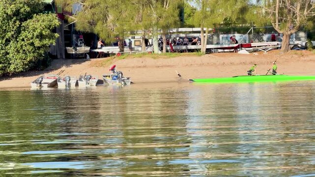 Rowers Training in Sculling Boats on a Calm River in Gold Coast