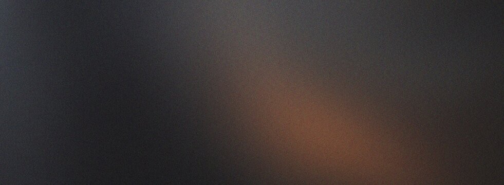 Subtle abstract dark background featuring a warm brown light leak with a fine grainy texture and soft diffused illumination