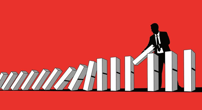Silhouette of a businessman in a suit stopping a line of falling dominoes, symbolizing intervention and control.