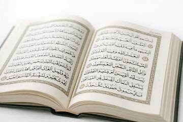 Obraz premium Open Holy Quran with Arabic text on white background