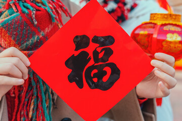 Person Holding Red Chinese New Year 'Fu' Character