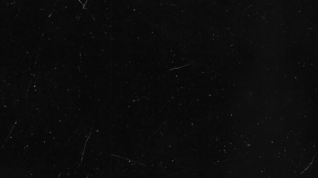 Dark background with fine white dust and subtle scratches