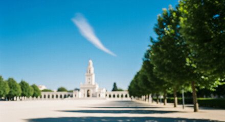 Obraz premium Soft focus background of a sunlit plaza leading to a grand white basilica in a European pilgrimage destination