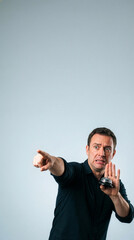 Scared Man Pointing And Holding A Service Bell