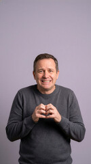 Mature Man Making Heart Shape With Hands