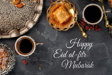 Naklejka premium Celebration of Eid al-Fitr with coffee, sweets, and traditional treats on a serving table