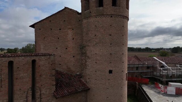 Aerial view of Calendasco village with historic castle and church in Italy