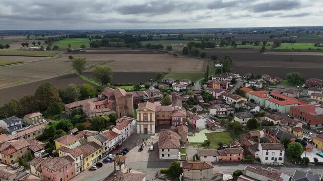 Aerial view of Calendasco village with fortified castle and Santa Maria Assunta parish church
