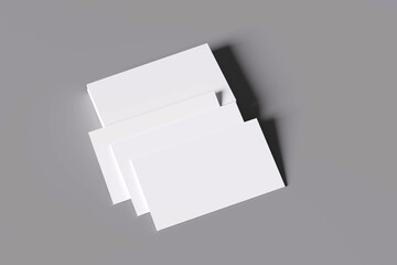 Empty business cards stacked on black and white background.