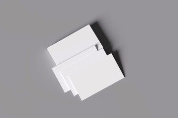 Empty business cards stacked on black and white background.