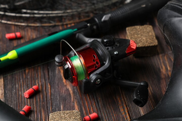 Set of fishing tackle on wooden background, closeup