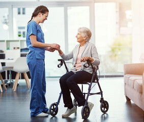 Fototapeta premium Nurse, support and old woman with rollator, holding hands and compassion for senior patient or care. Hospital, physical therapy and caregiver with smile for elderly person, recovery and healthcare
