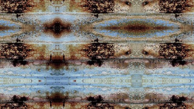 Swirling blue brown white patterns converge around central cross design