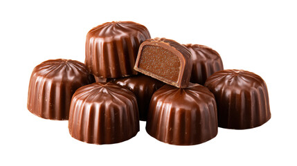 Obraz premium Stack of fluted chocolate candies, one shown in cross section revealing smooth ganache filling, isolated on transparent background, delicious sweet treat