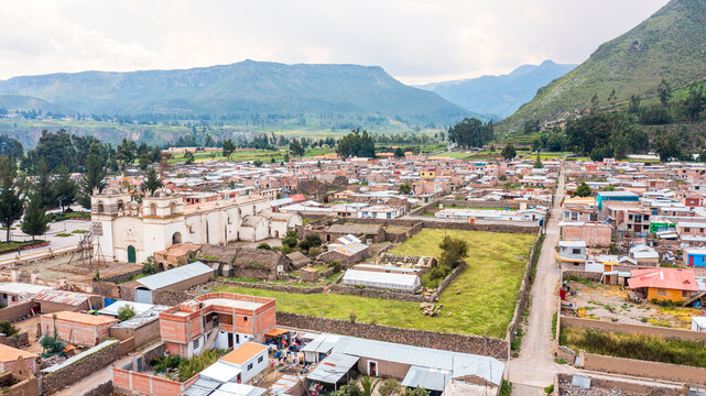 Aerial view of Yanque village in the Colca Valley with its colonial church and ancient terraces, Arequipa, Peru