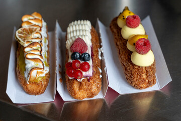 Three Gourmet &Eacute;clairs with Berry and Passion Fruit Flavors
