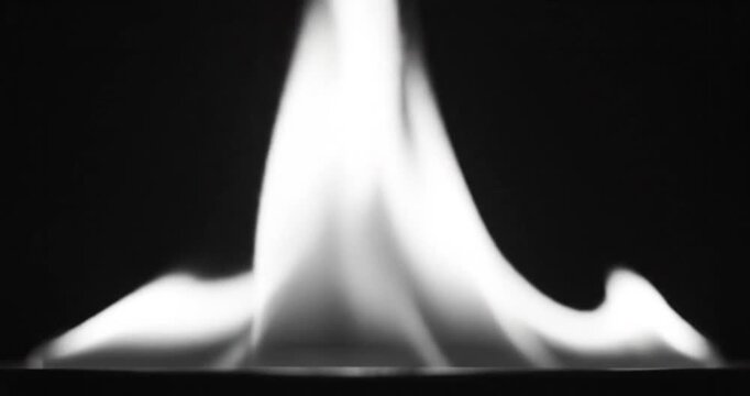 Flame burning in the dark.