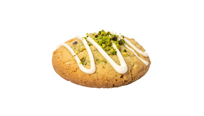 Close-up of a single cookie with white icing, sprinkled pistachio, on a black background