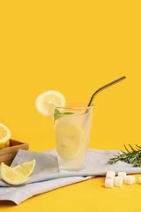 Fototapete Rund Zu Essen Glass of fresh lemonade with mint and rosemary on yellow background  © Pixel-Shot