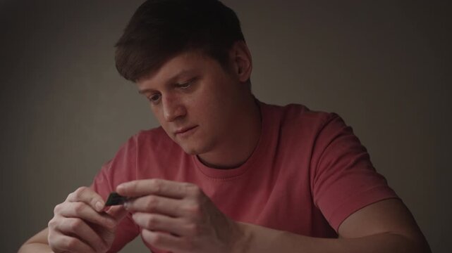 Person examining ram module, holding computer memory component, checking for technical issues, performing diagnostics and hardware repair on electronic part. Concept of hardware, repairing, upgrade.