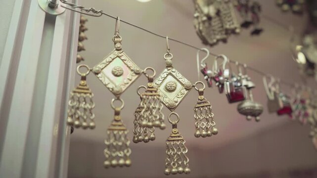 Indian silver earrings displayed at a street market in Mumbai