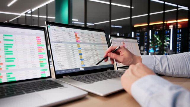 Financial Analyst Man Using Spreadsheet Software On Laptop To Analyze Data