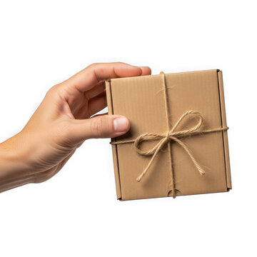 Hand holding a small brown package tied with a string