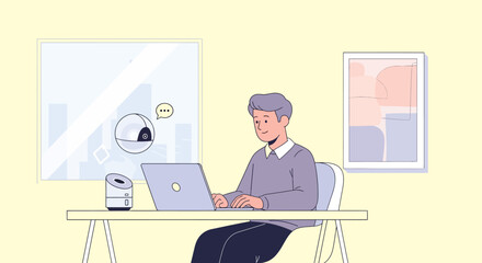 A man working on a laptop at a desk with a smart device and artwork on the wall