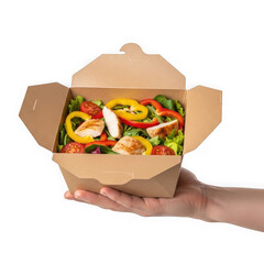 Person holding a cardboard takeout box with fresh salad inside