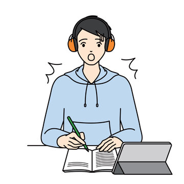 Surprised student wearing earmuffs feeling shocked at desk