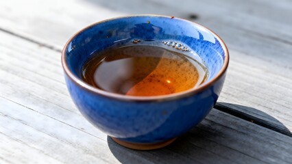 BlueCeramicTeaCupWoodenTable