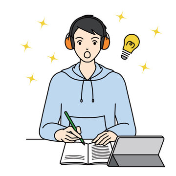 High school boy with earmuffs finding an idea while studying