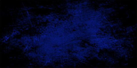Naklejka premium Grungy dark blue abstract background featuring a textured vintage wall surface with glowing particles and smoke patterns over an aged midnight sky backdrop