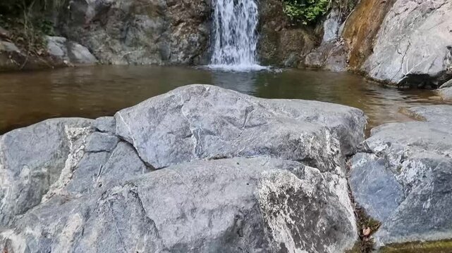 Cascading waterfalls on mossy rocks in Cyprus gorge