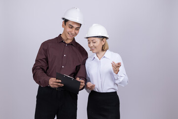 Team of construction workers looking at digital tablet