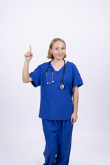 Female doctor in blue scrubs showing thumb up gesture
