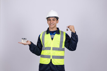 Professional engineer holding small device and pointing thumb