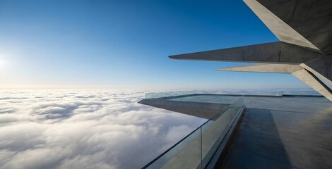 Fototapeta premium A sleek, modern concrete and glass observation deck extends dramatically above a vast sea of white clouds under a brilliant blue sky.