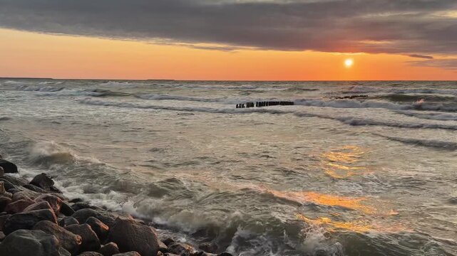Golden hour sunset over sea with rolling waves and warm horizon. Coastal mood for relaxation and travel. Concept of emotional reset peace freedom and end of day reflection.