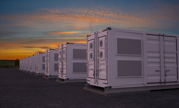 battery storage. Large white container units with dramatic sunset.