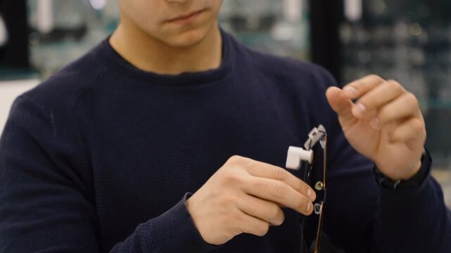 Close up of man hands holding and choosing glasses