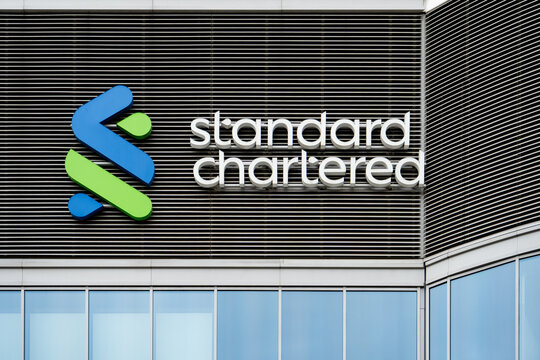 Standard Chartered logo sign. A leading international bank providing global financial services, corporate banking, and wealth management solutions on March 24, 2025 in Warsaw, Poland.