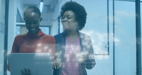 Reviewing two staff viewing laptop in office, wearing workwear, holding cup, data overlay