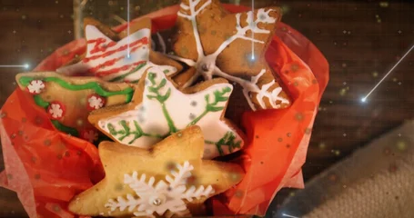 Fotobehang Vlees Displaying iced cookies filling red paper bowl on wood table, with piped icing and silver dragees  © vectorfusionart