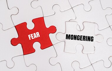 Fototapeta premium FEAR MONGERING word alphabet letters on puzzle. Propaganda, manipulation and the psychological impact of media misinformation concepts