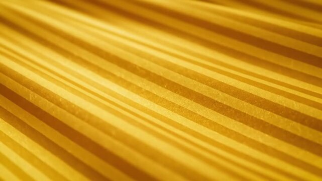 Golden fabric with light and dark stripes at an angle